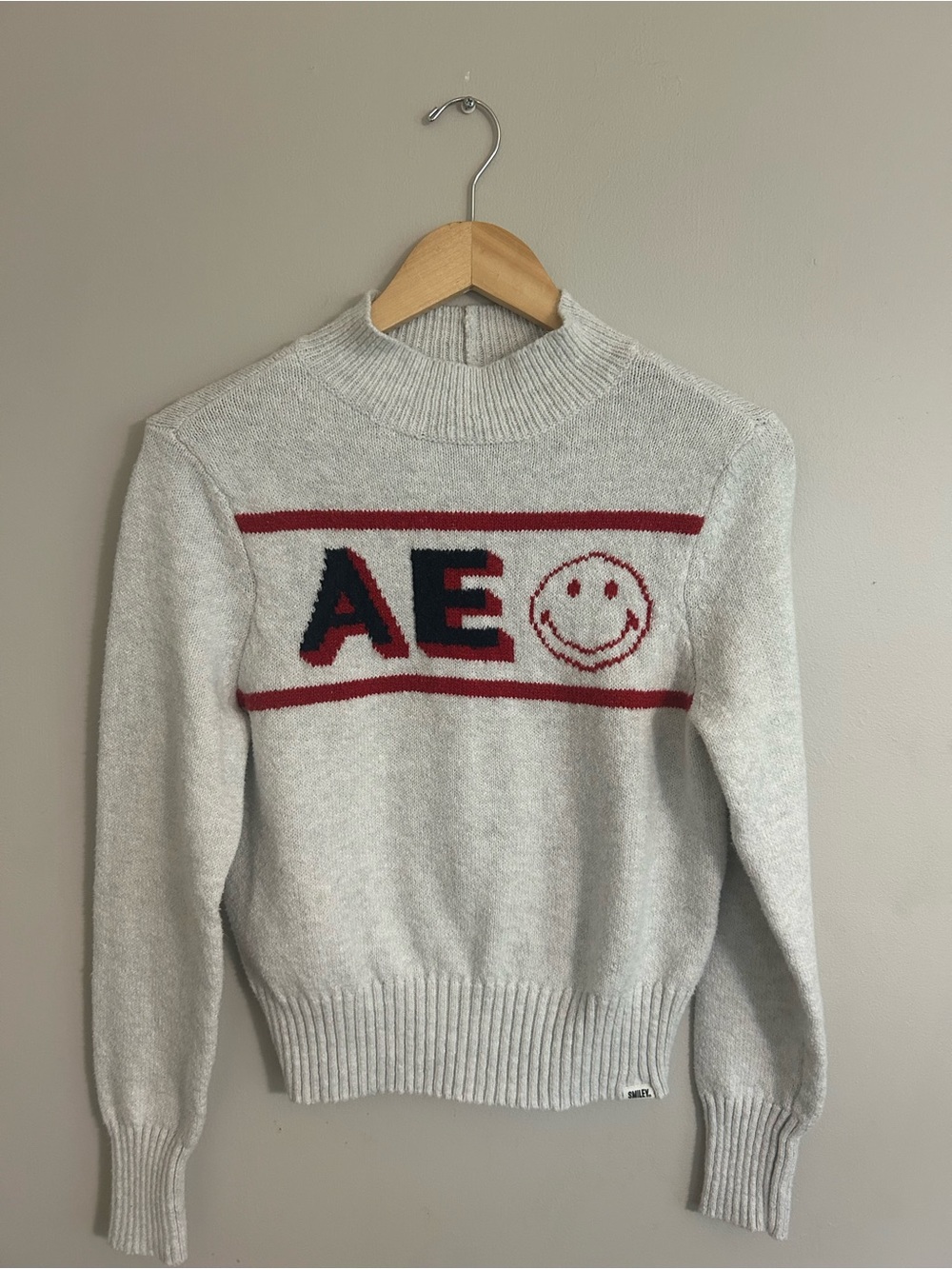 Cream Crewneck Sweater with Navy and Red Smile